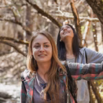 close-up-girl-smiling-with-her-friend_23-2147617390
